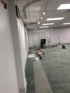 A room with several pieces of equipment on the floor.