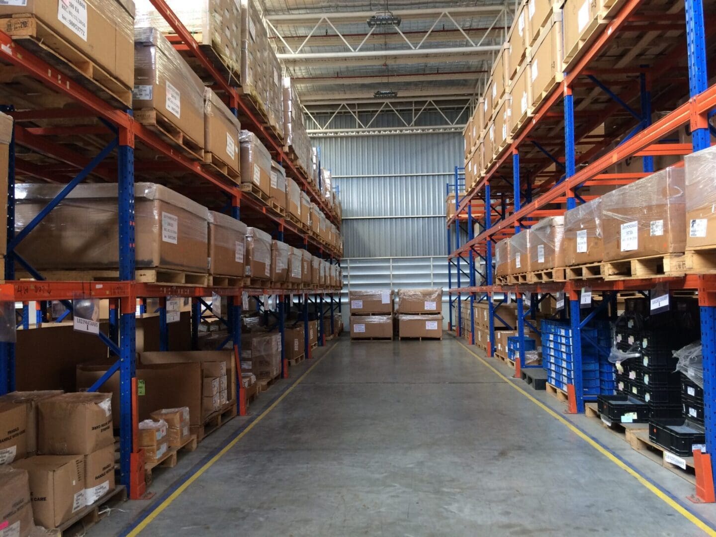 A warehouse filled with lots of shelves full of boxes.