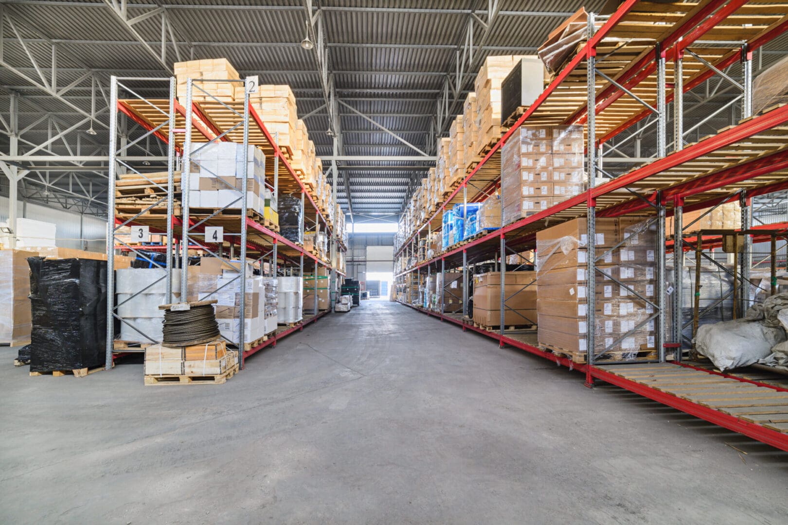 A warehouse filled with lots of boxes and shelves.