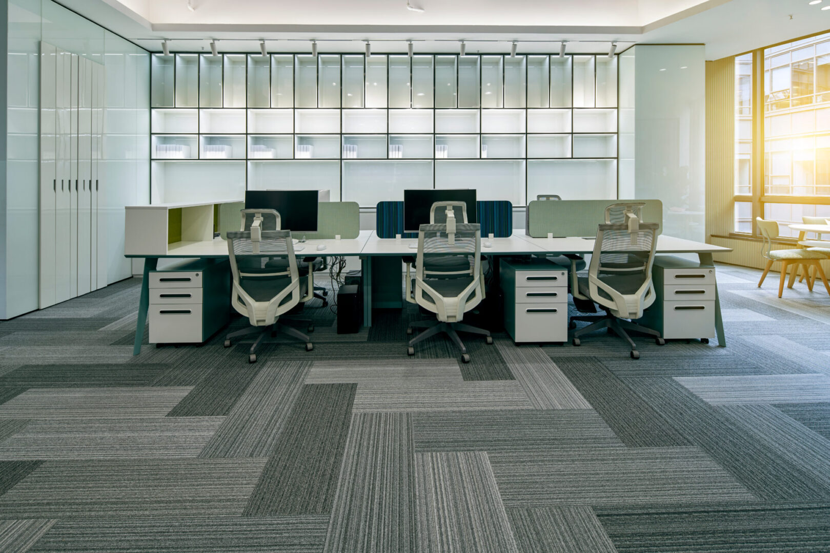 A room with several desks and chairs in it.