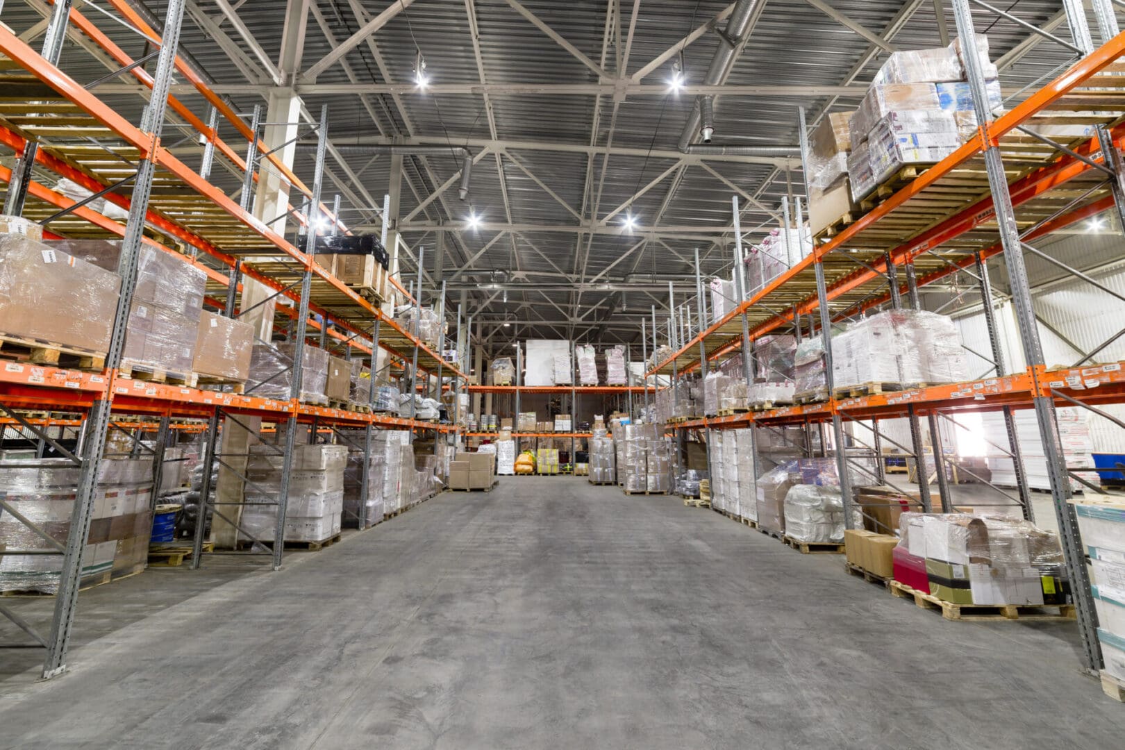 A warehouse filled with lots of boxes and shelves.