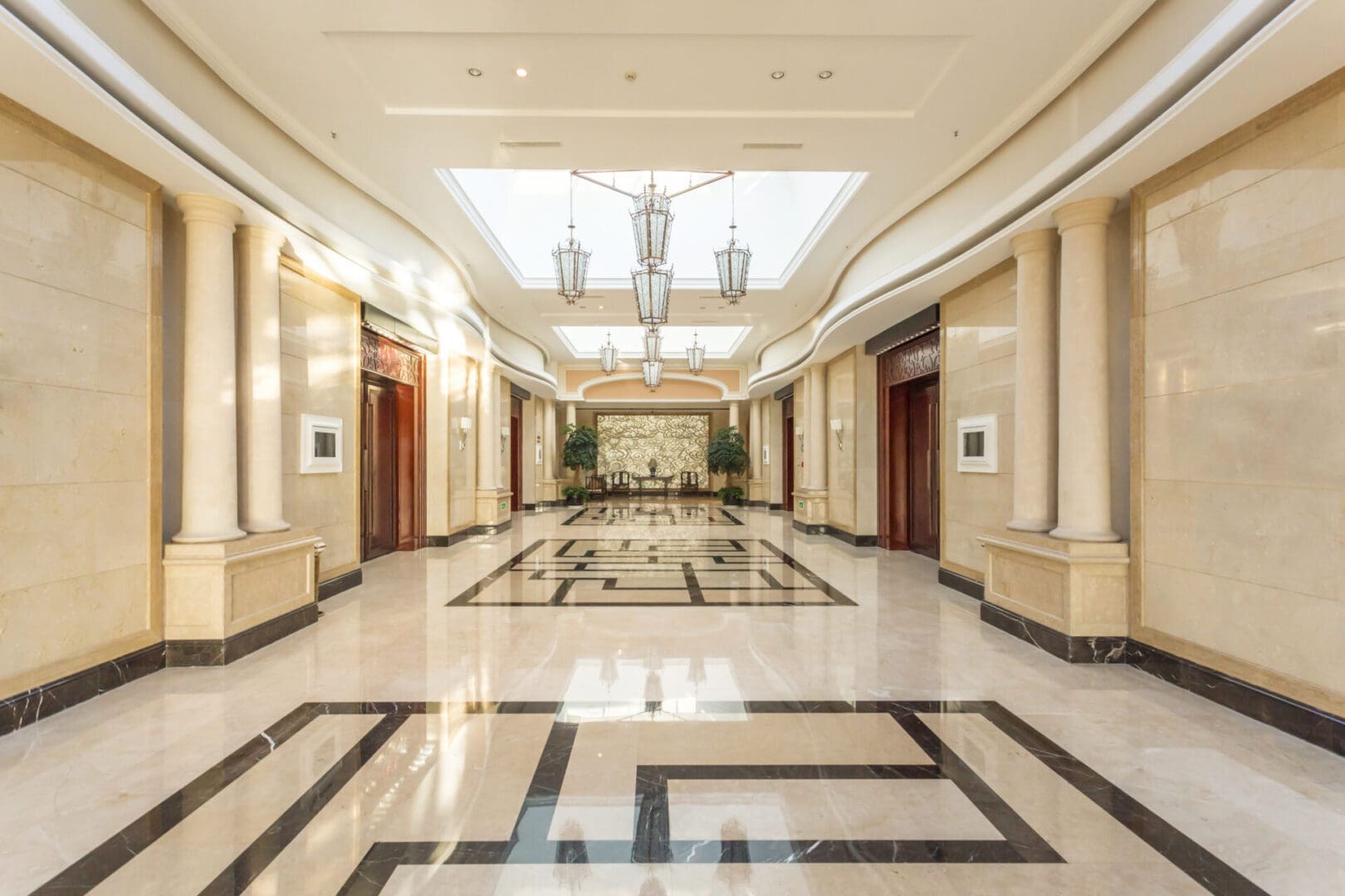 A large hallway with marble floors and white walls.