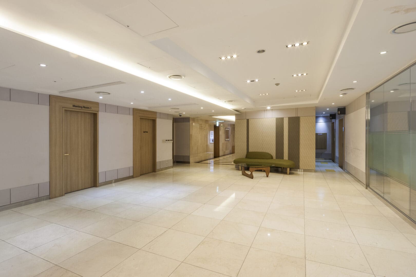 A large room with white tile floors and walls.