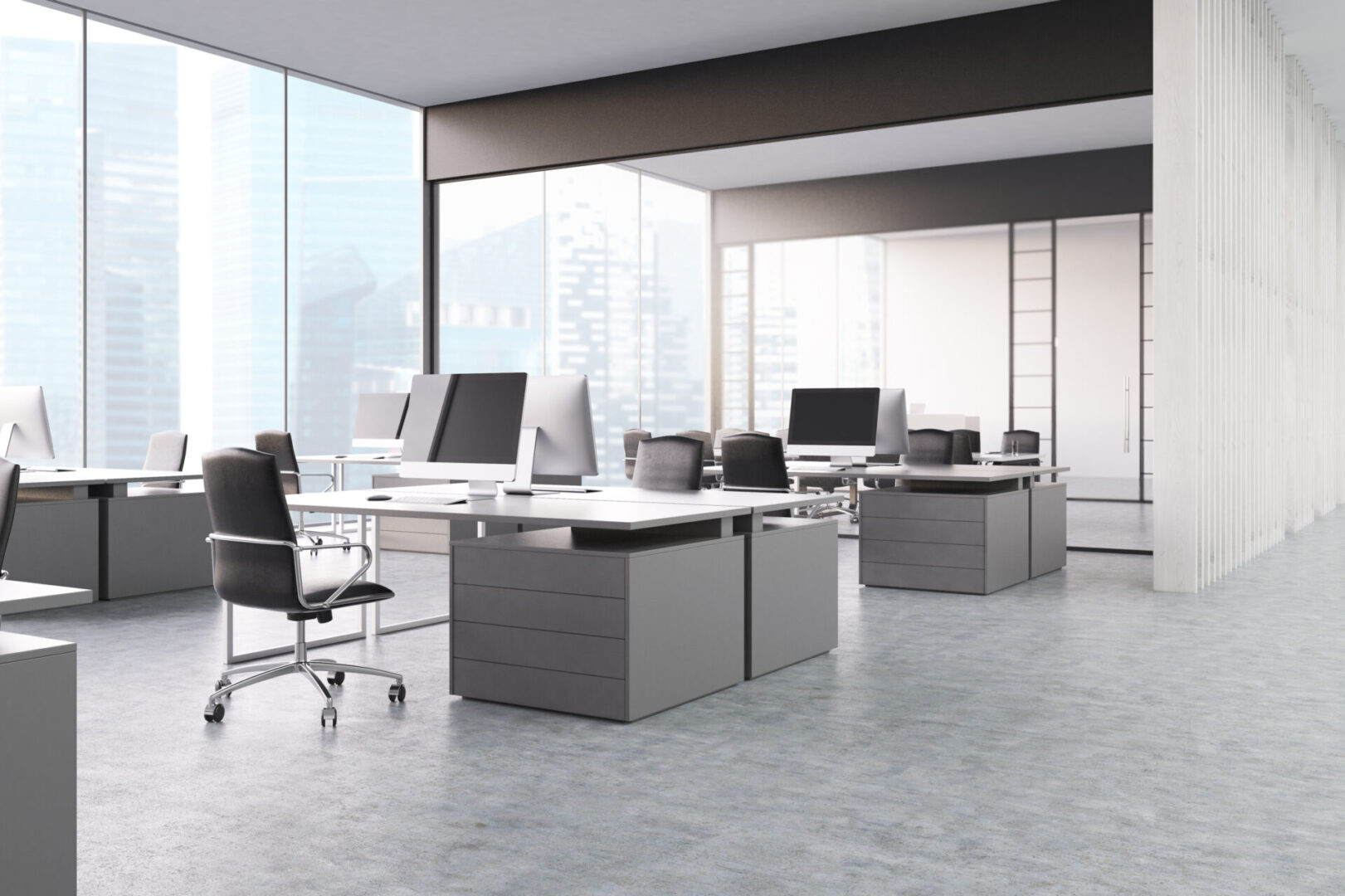 A large open office space with desks and chairs.