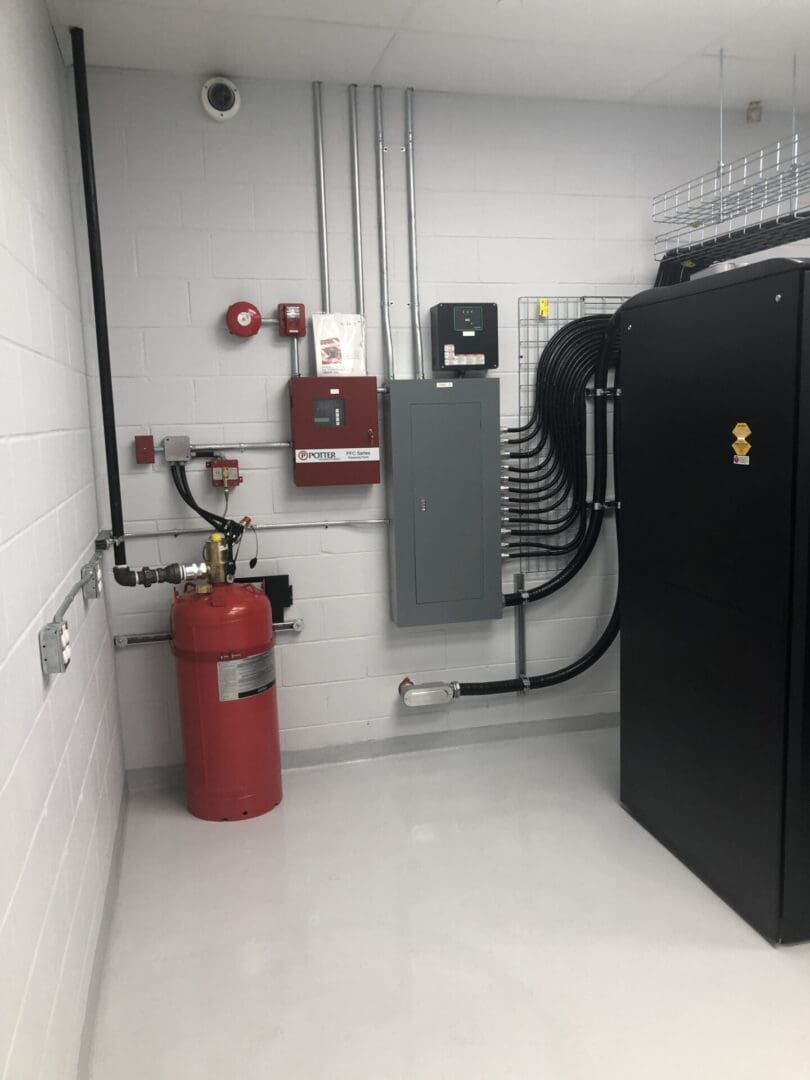 A fire hydrant and electrical box in an office.