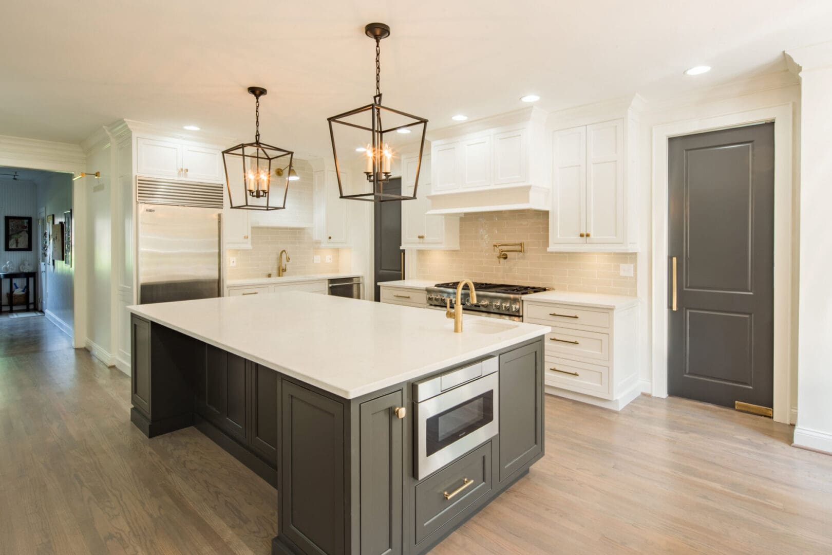 A kitchen with two lights and a microwave