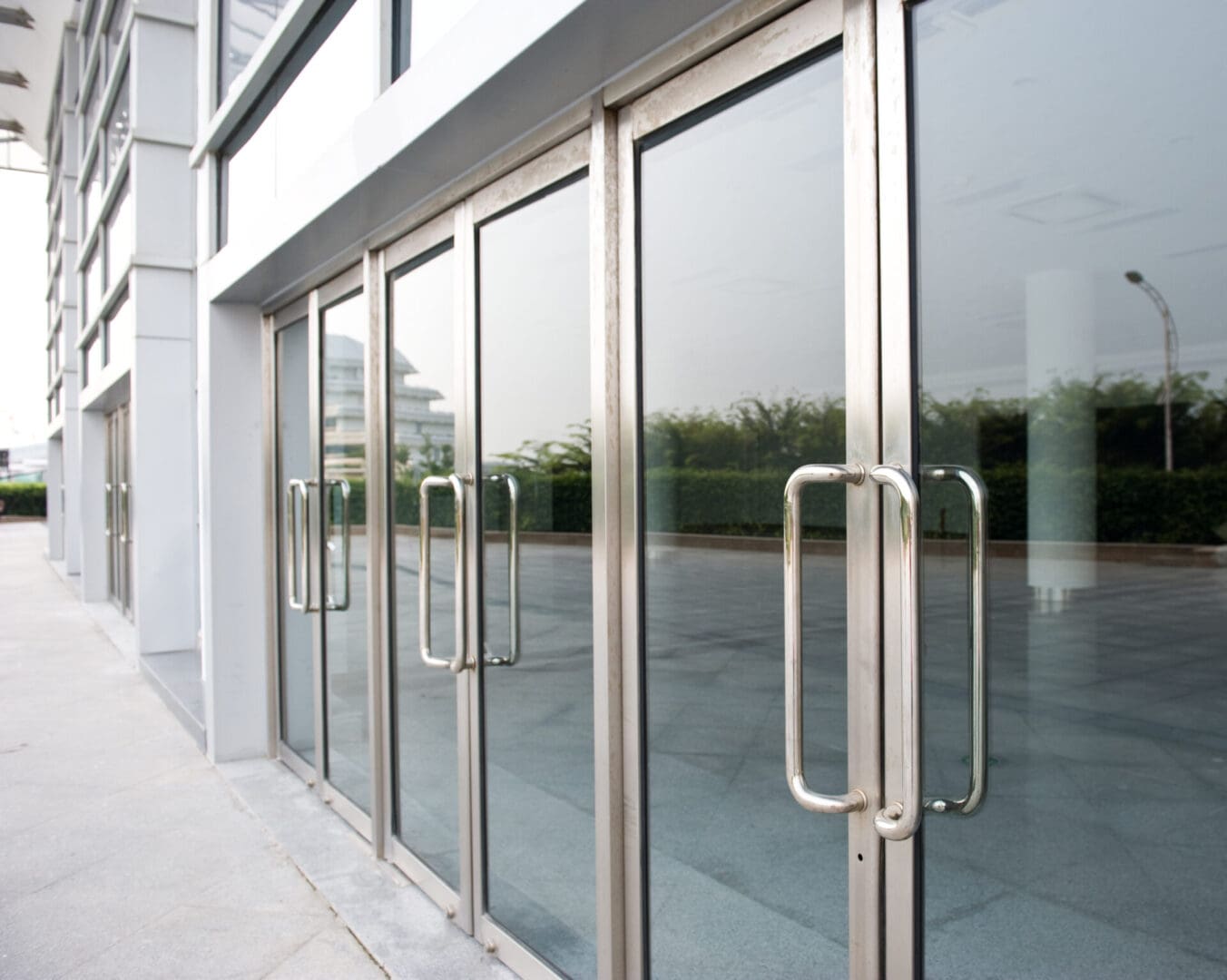 A glass door with some metal handles on it