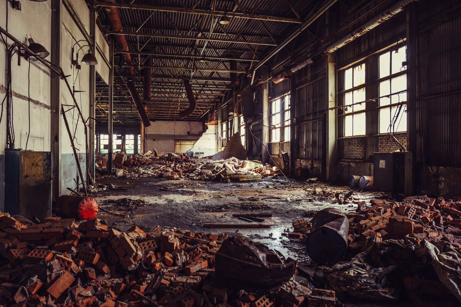 A warehouse filled with lots of debris and trash.