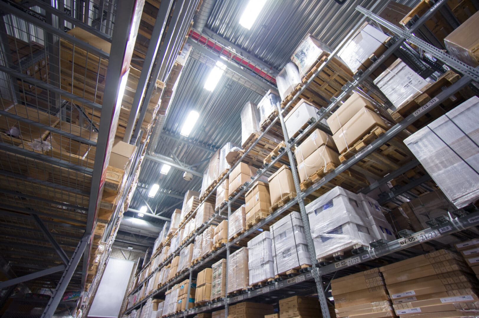 A warehouse filled with lots of boxes and shelves.