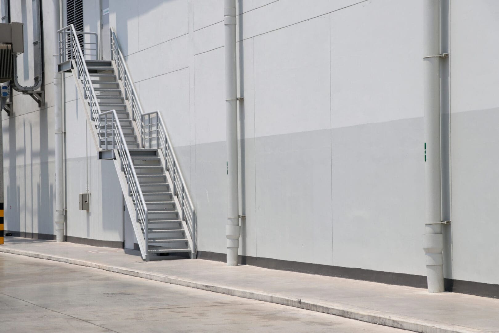 A metal staircase on the side of a building.