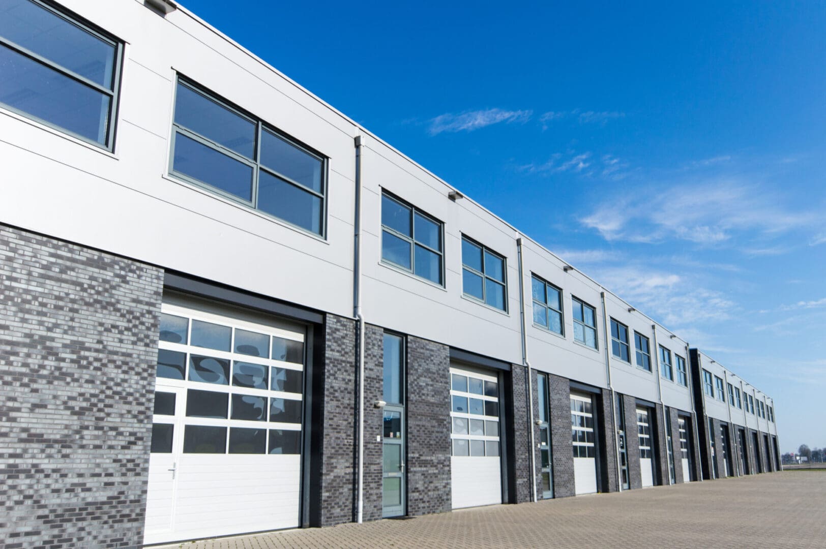 A large building with many windows and doors.