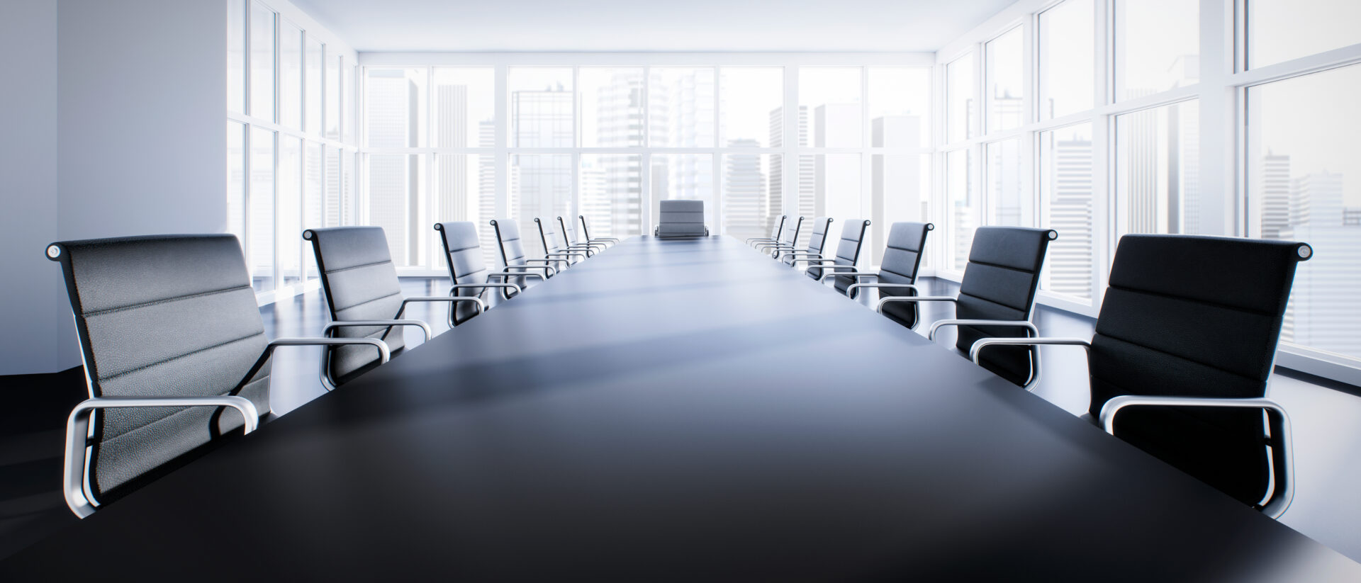 A large conference table with chairs around it.