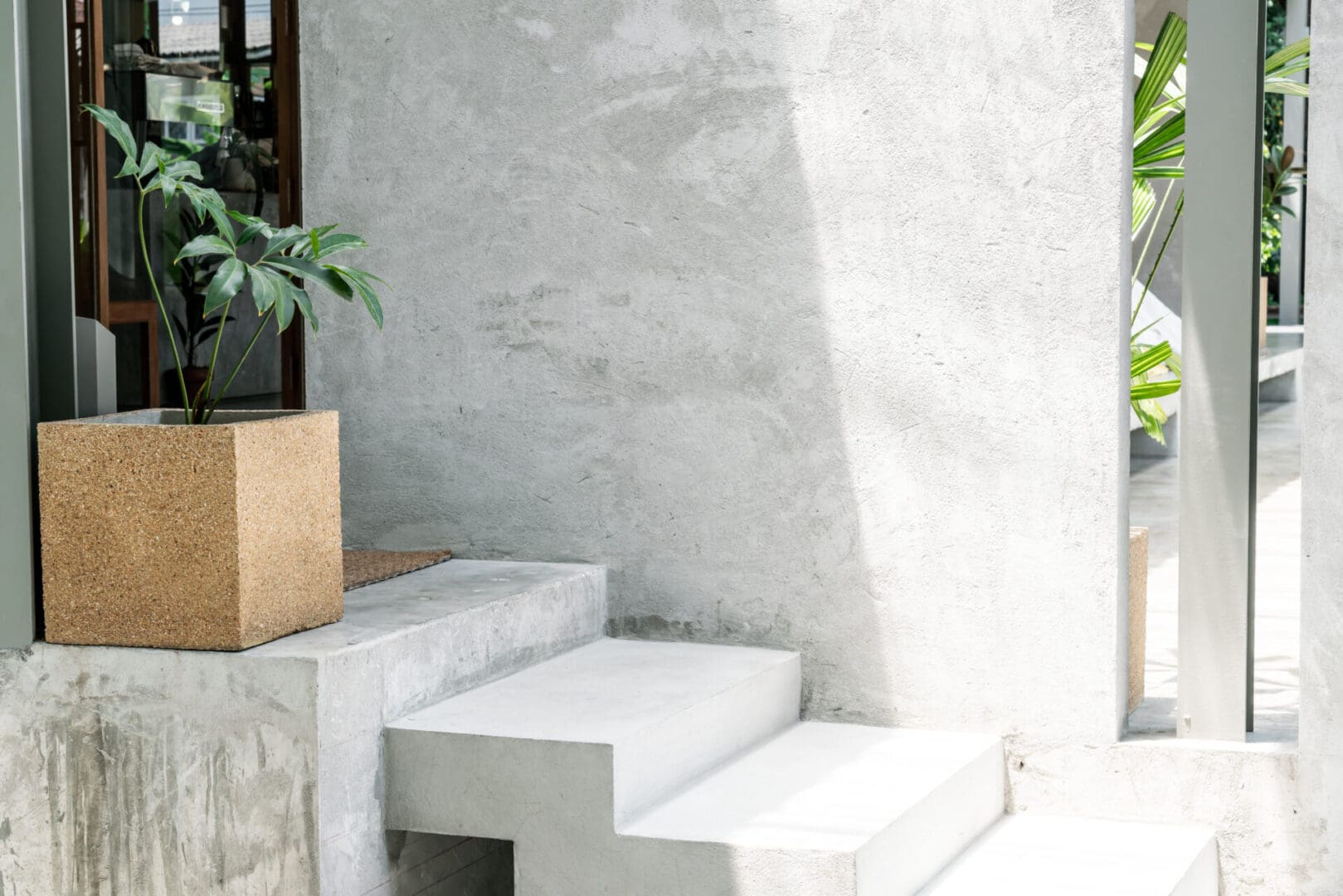 A white staircase with steps leading up to it.