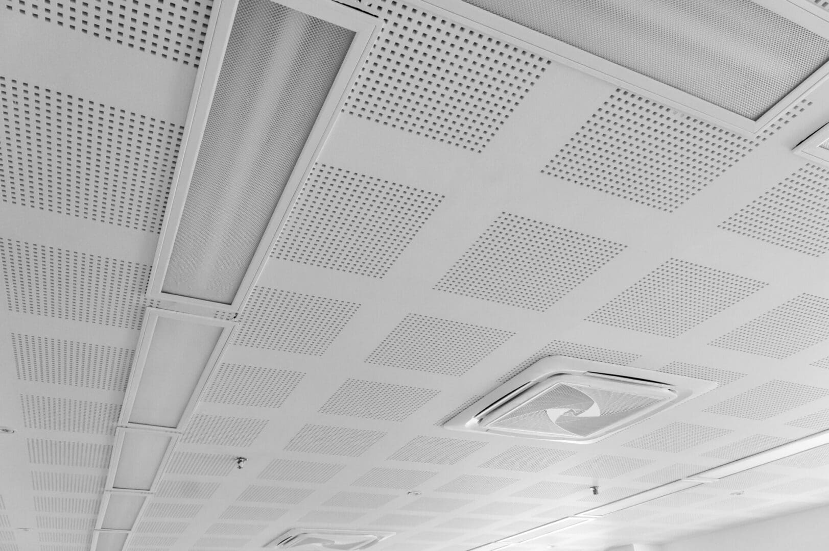 A ceiling with many holes in it