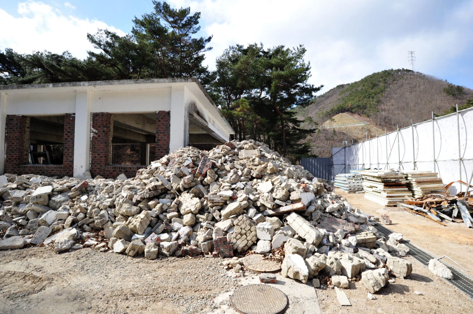 A pile of rocks in front of a building.