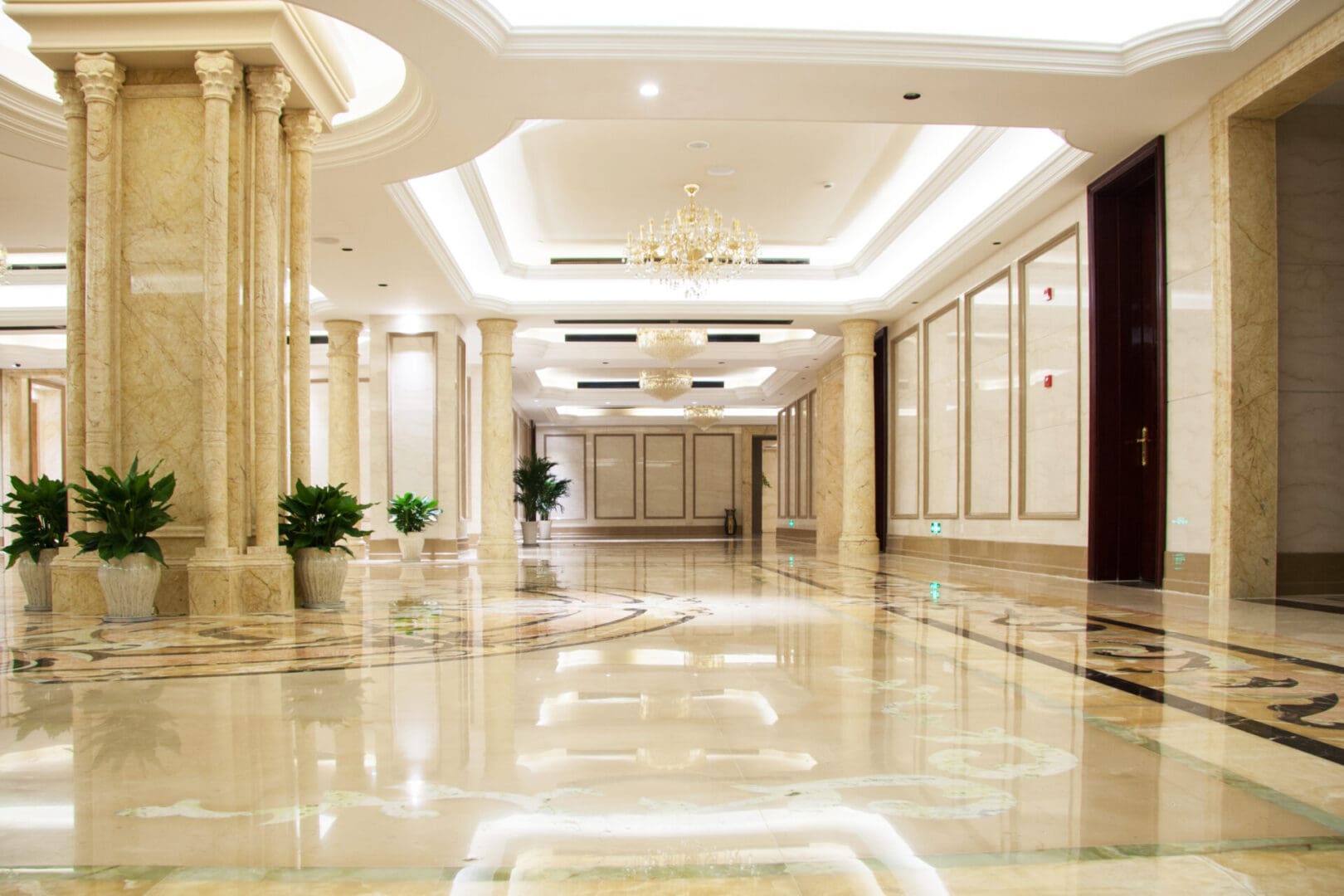 A large hallway with pillars and lights in it