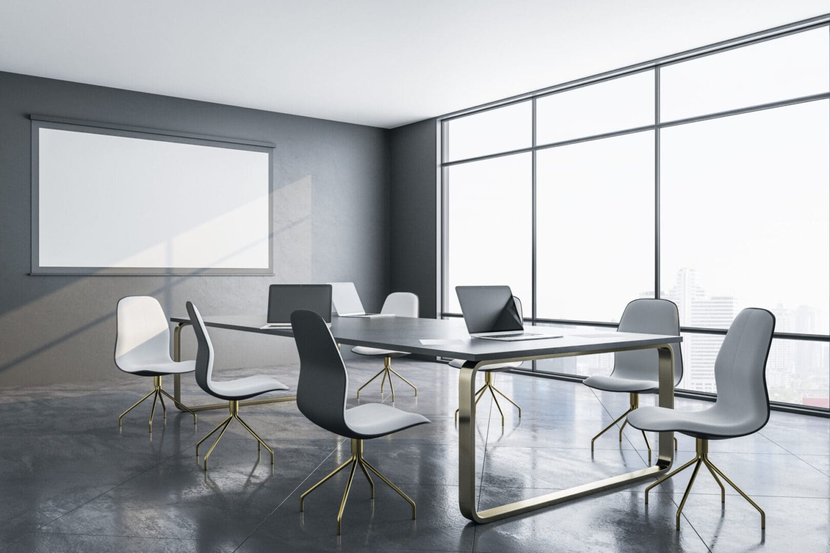 A conference room with chairs and tables in front of windows.