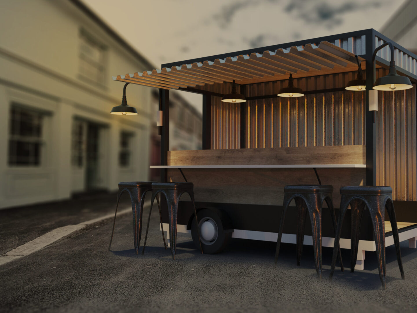 A food truck with tables and chairs outside.