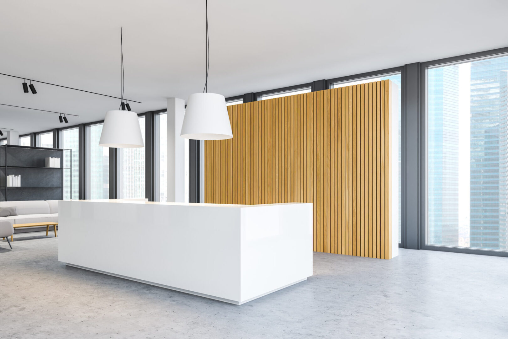 A white reception desk in front of a wooden wall.