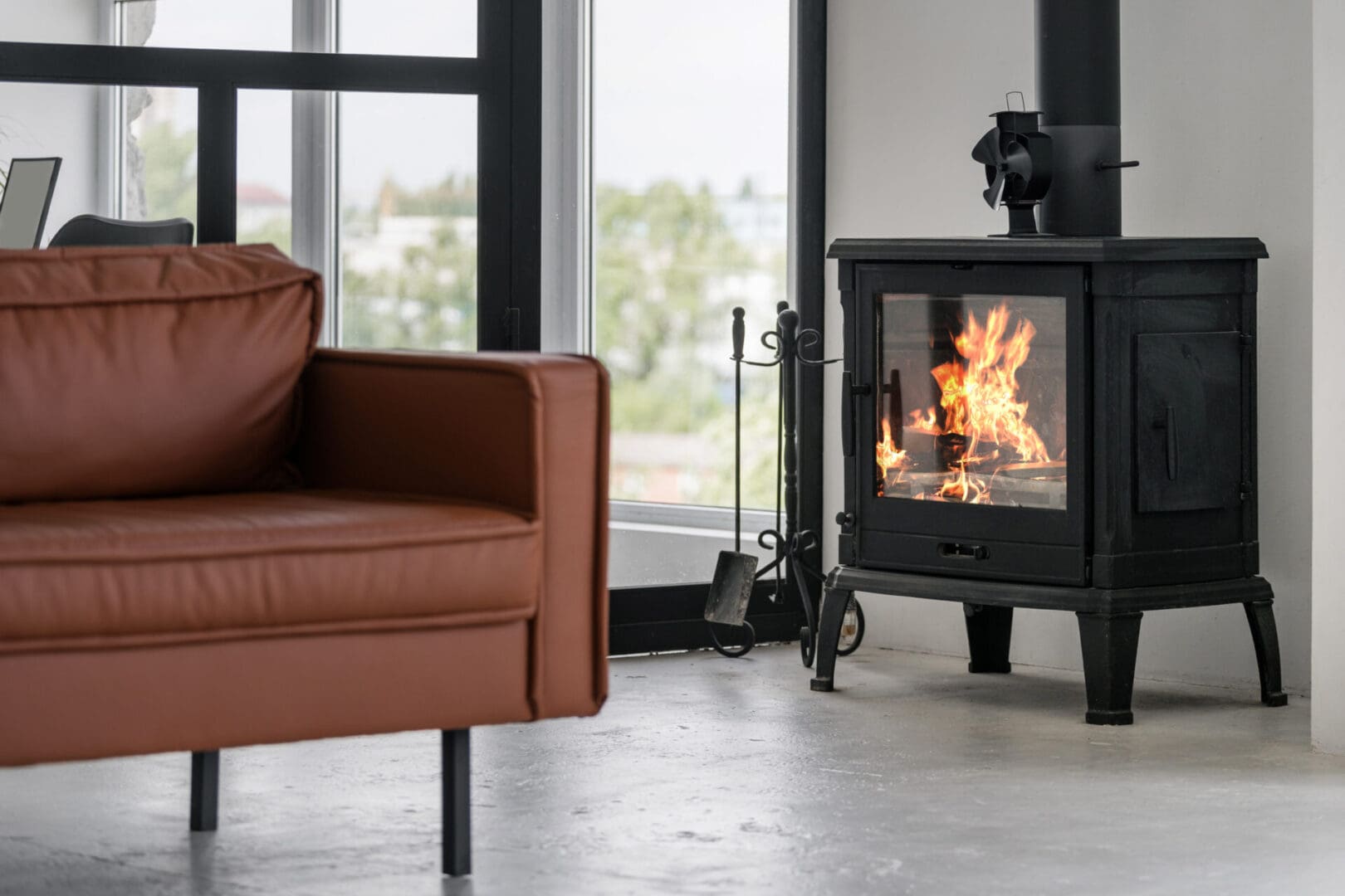 A brown chair and fireplace in a room.