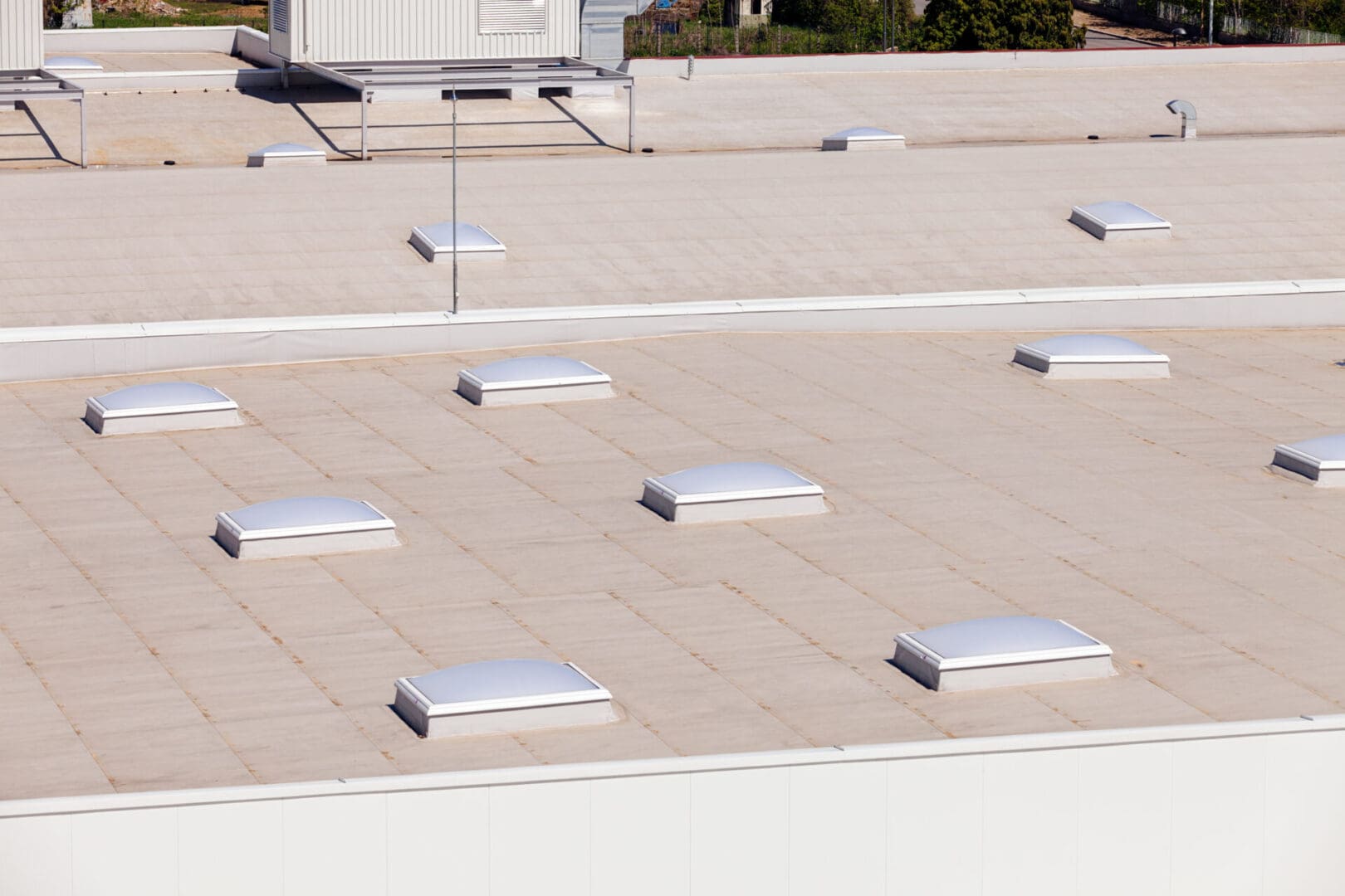 A roof with many skylights on it