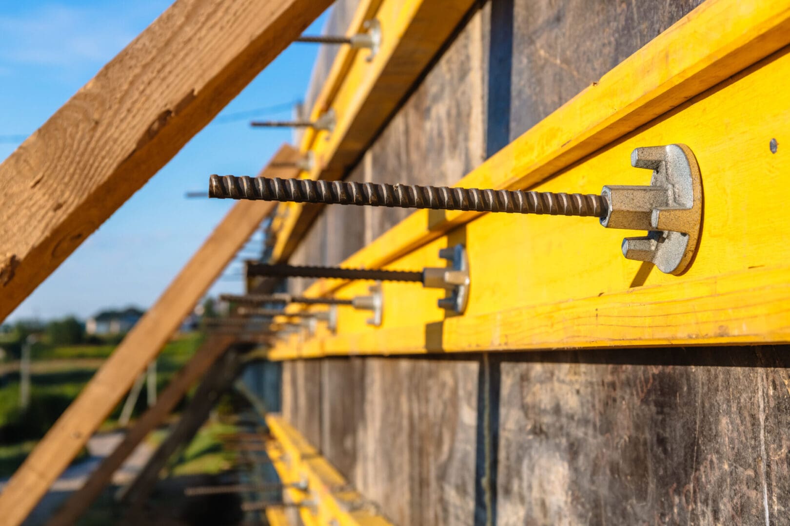 A close up of some building supplies hanging on the side of a building.