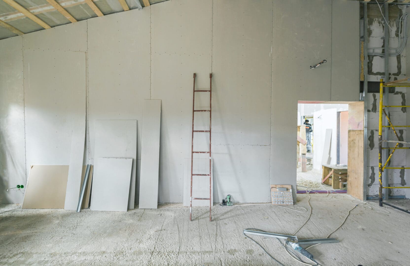 A ladder in the middle of a room with walls