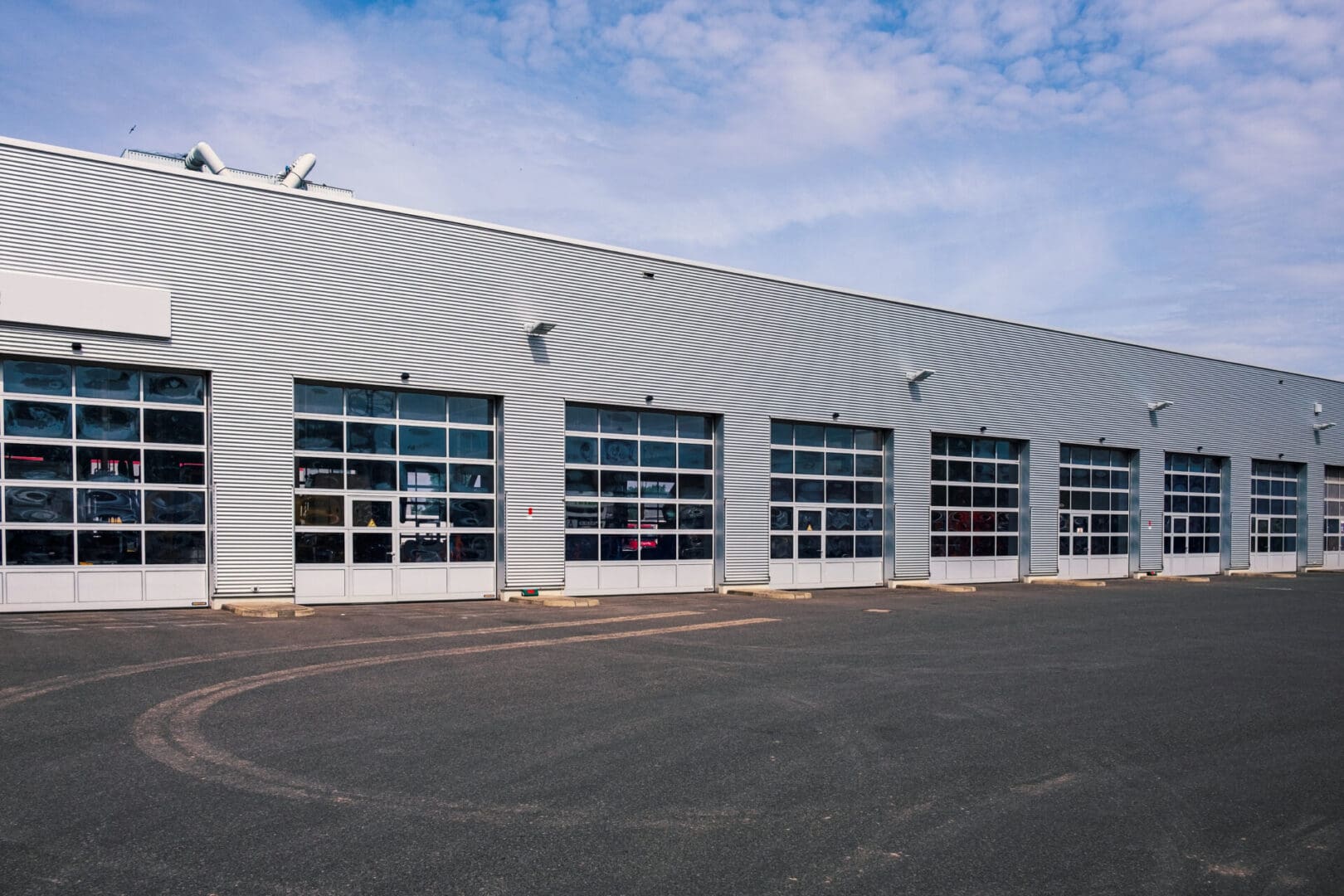 A large building with many windows on the side.