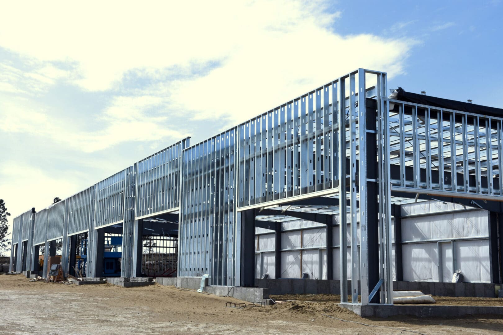A building under construction with metal framing.