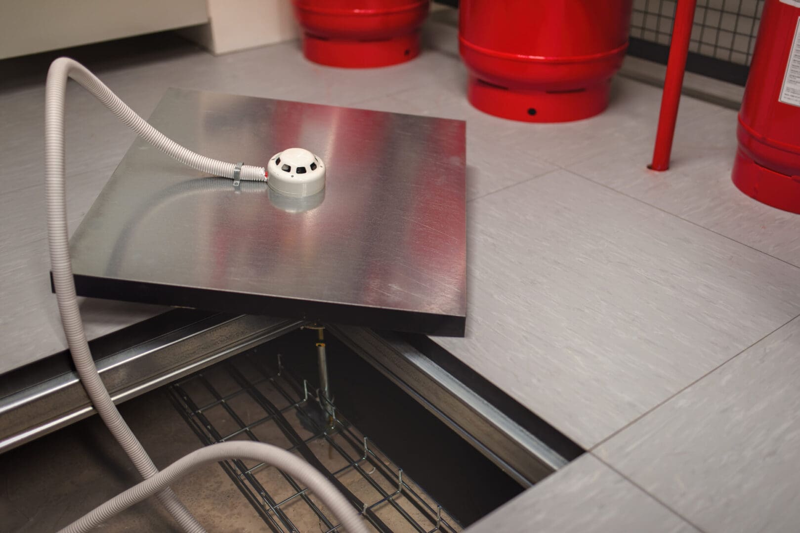 A kitchen counter with an outlet plugged in.