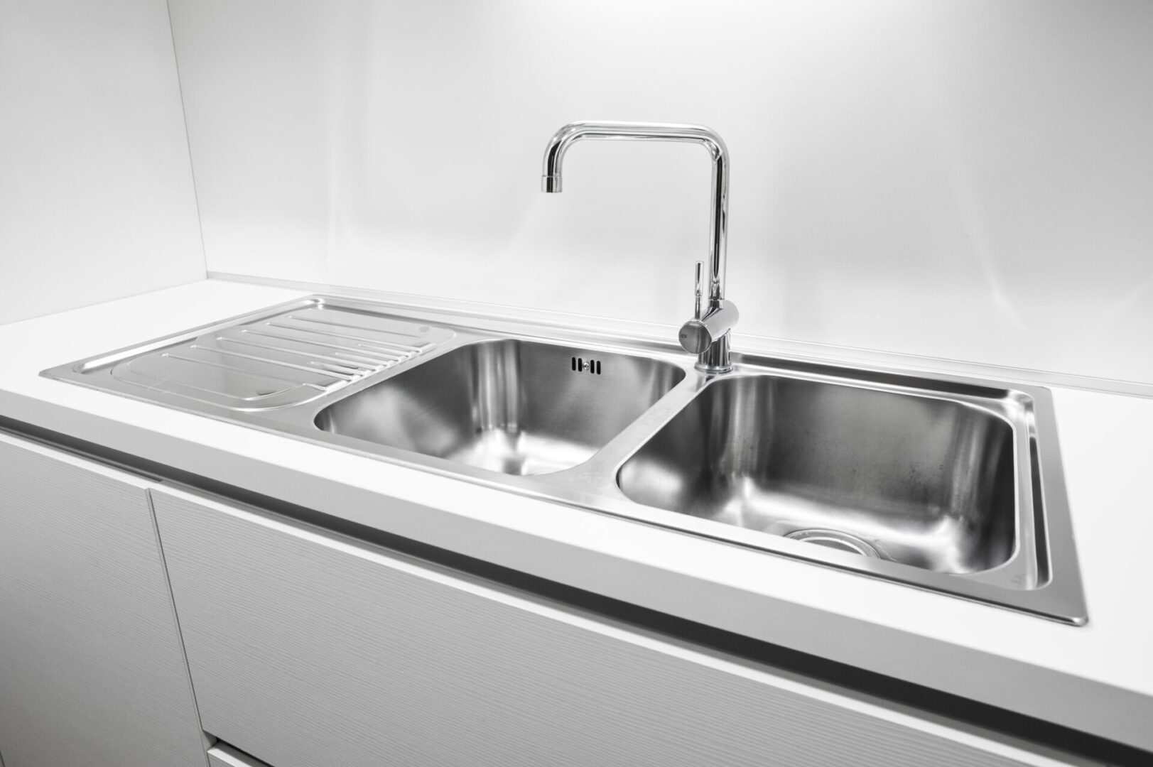 A close up of the sink in a kitchen
