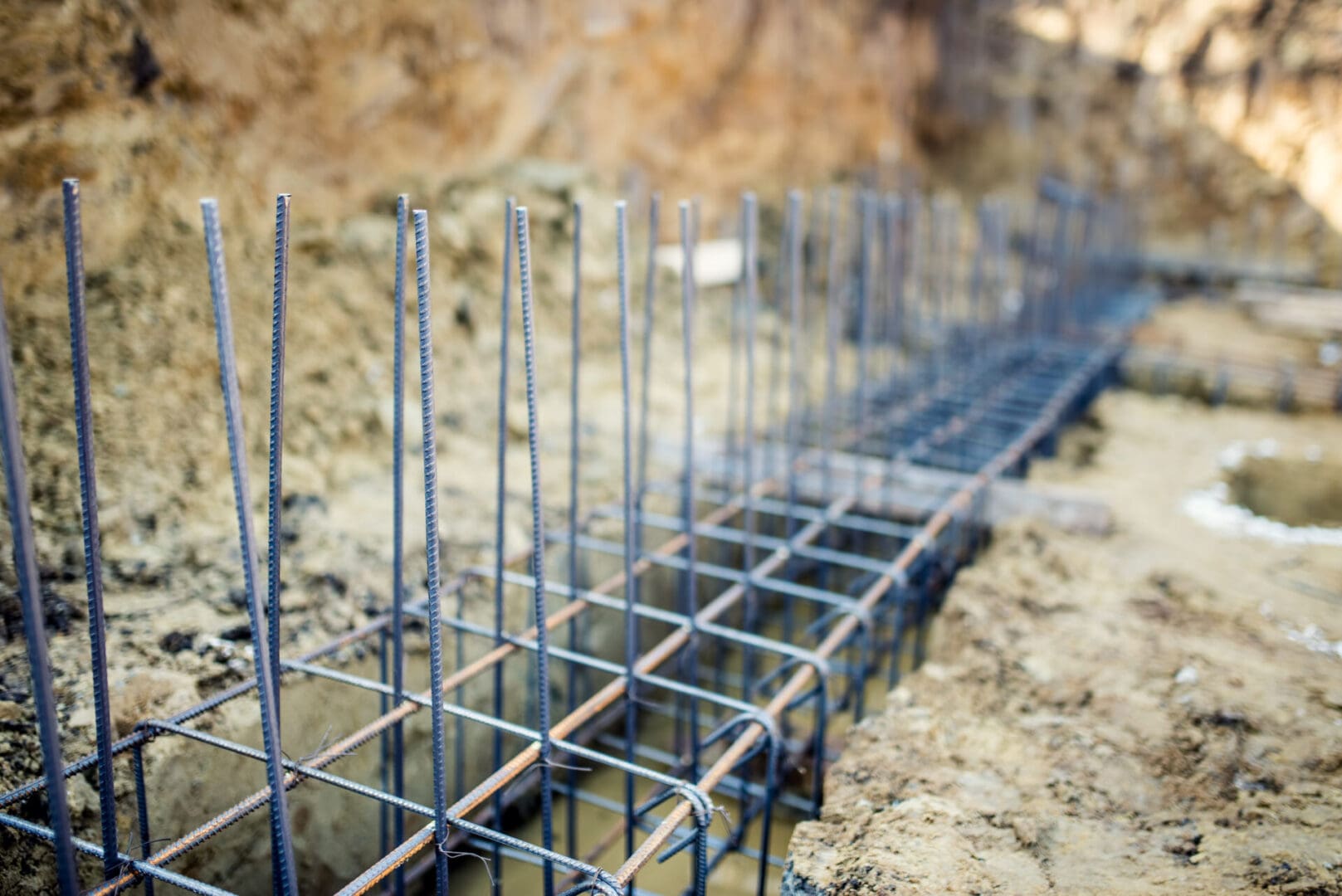 A close up of some metal rods in the ground