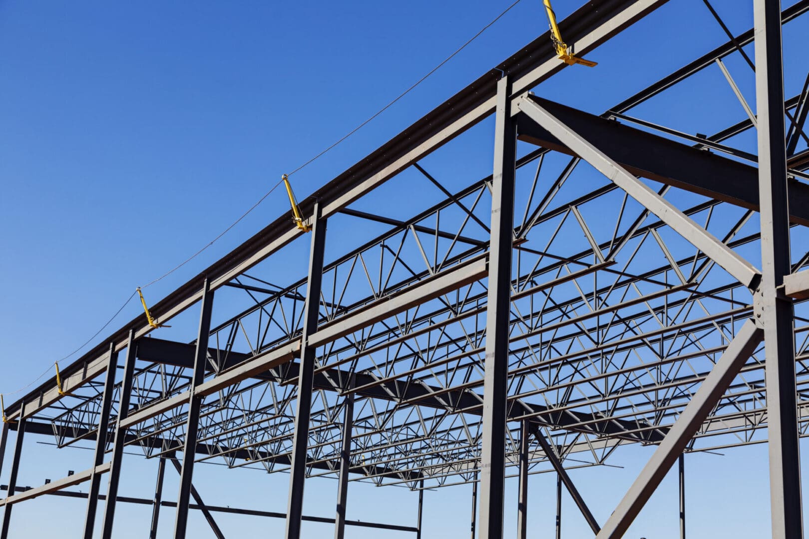 A steel structure with a blue sky in the background.