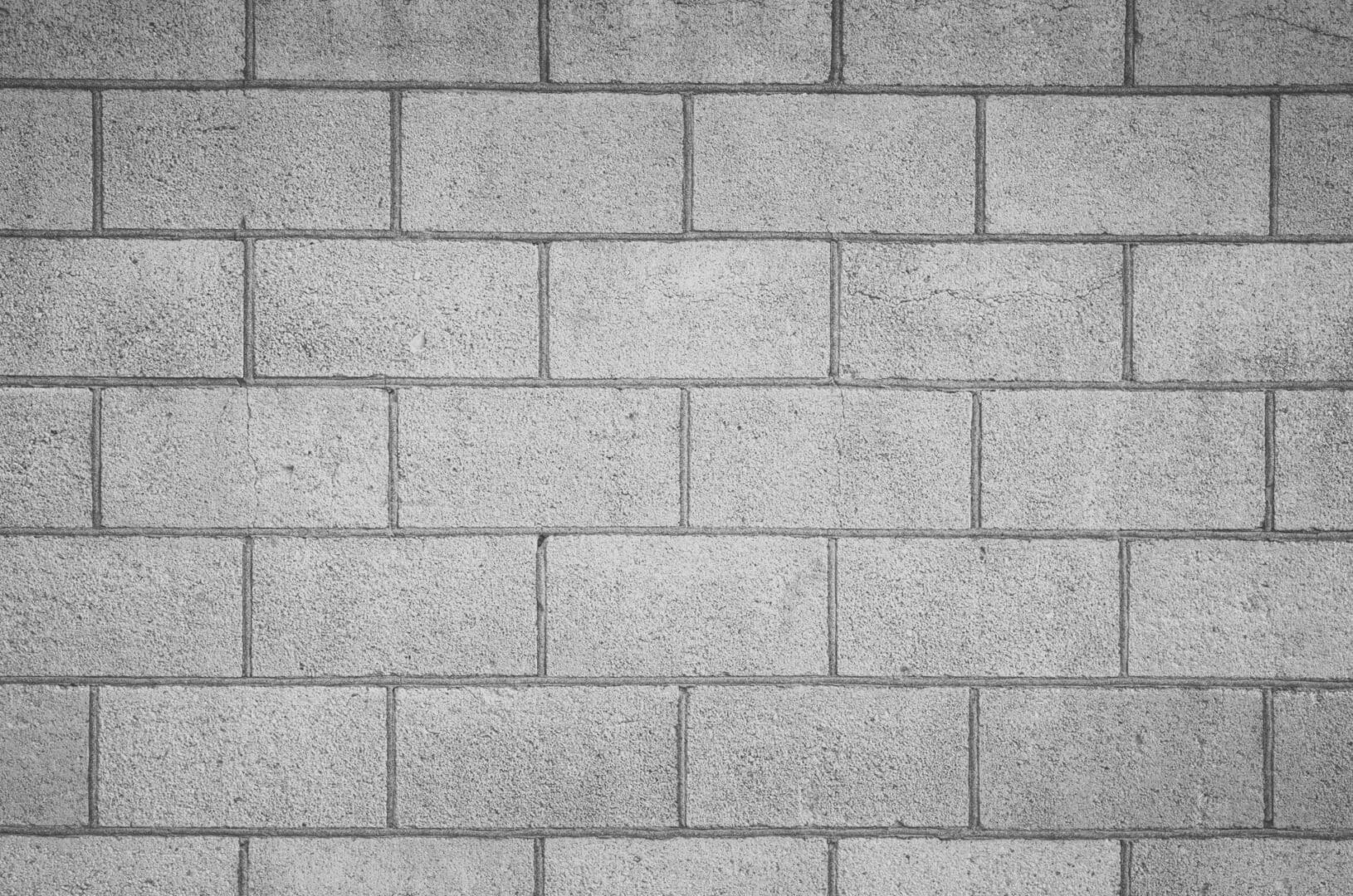 A brick wall with some kind of white paint