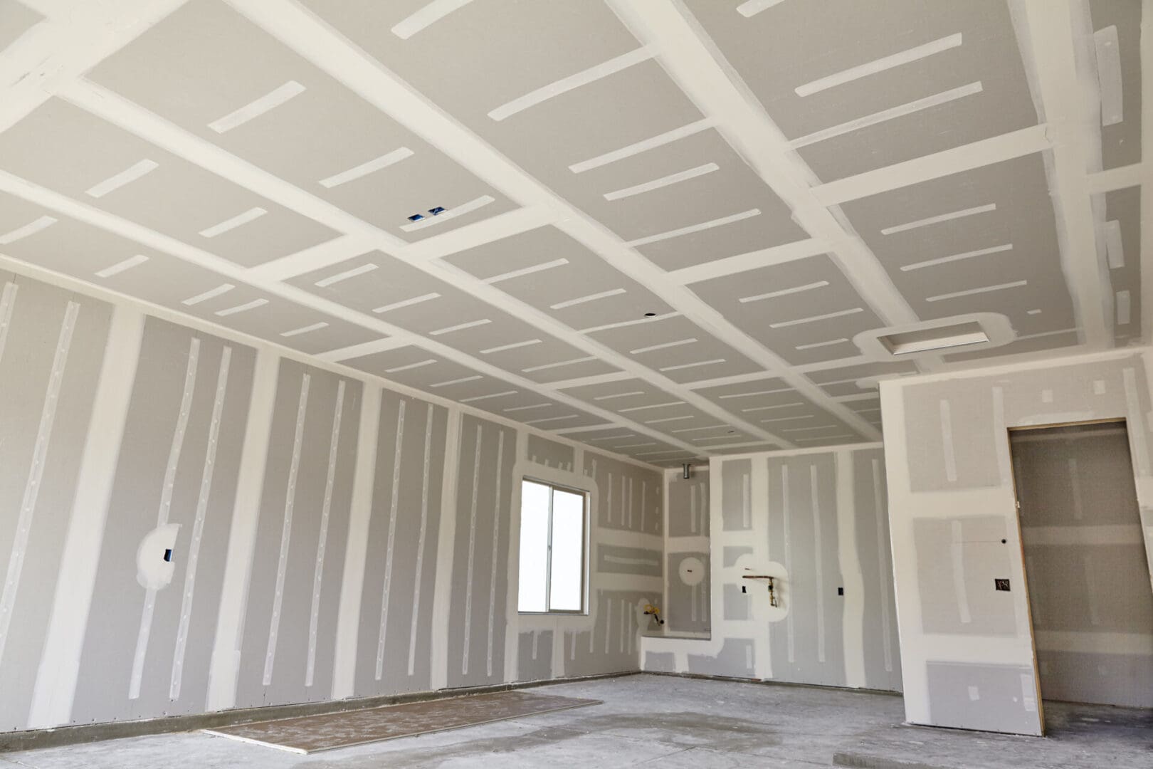 Construction,Building,Industry,New,Home,Construction,Interior,Drywall,Tape,And A room with white walls and ceiling in it