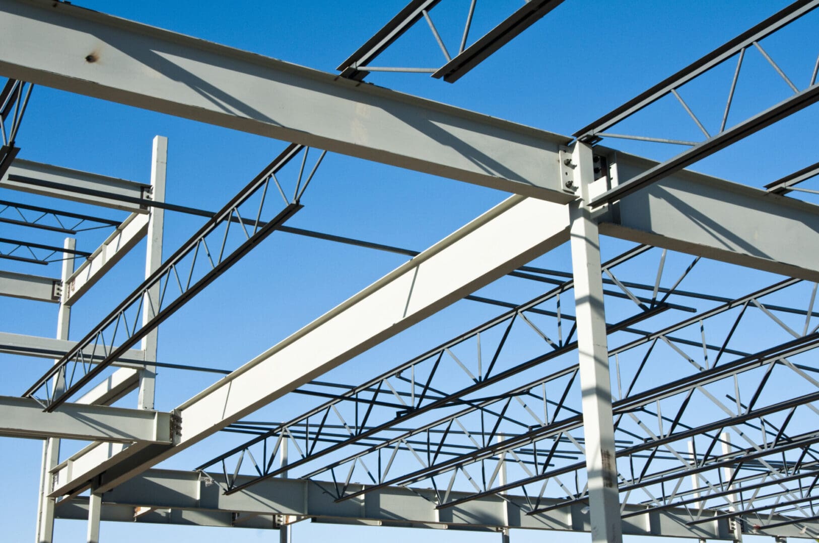 A steel structure with beams and supports for the roof.