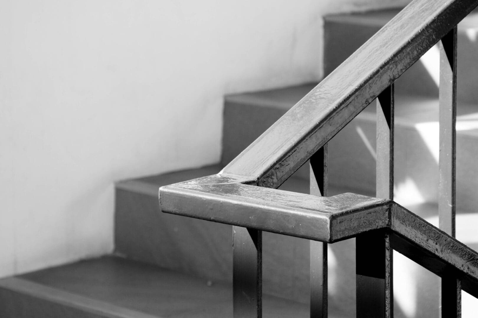 A metal railing on the side of stairs.