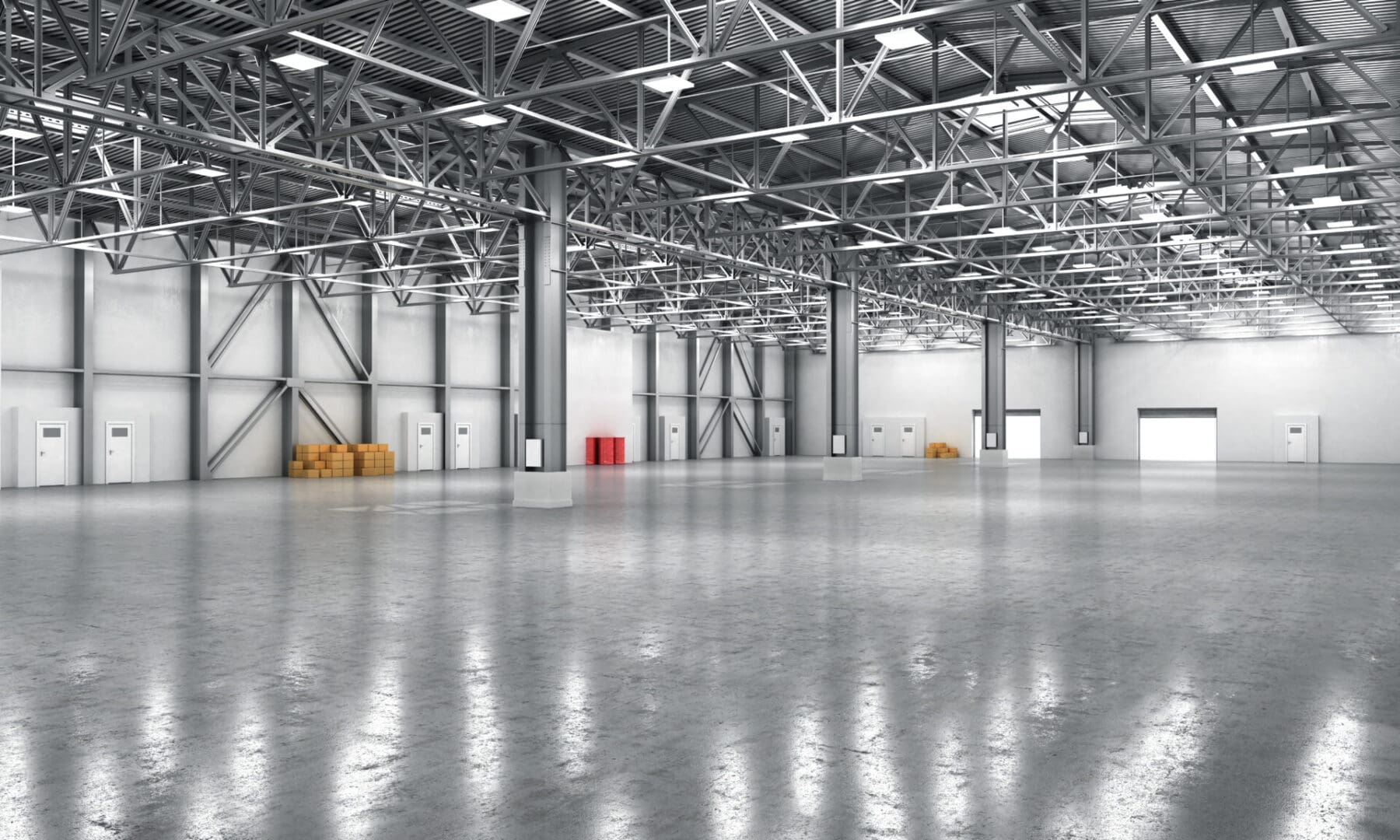 A large warehouse with lots of lights and concrete floors.