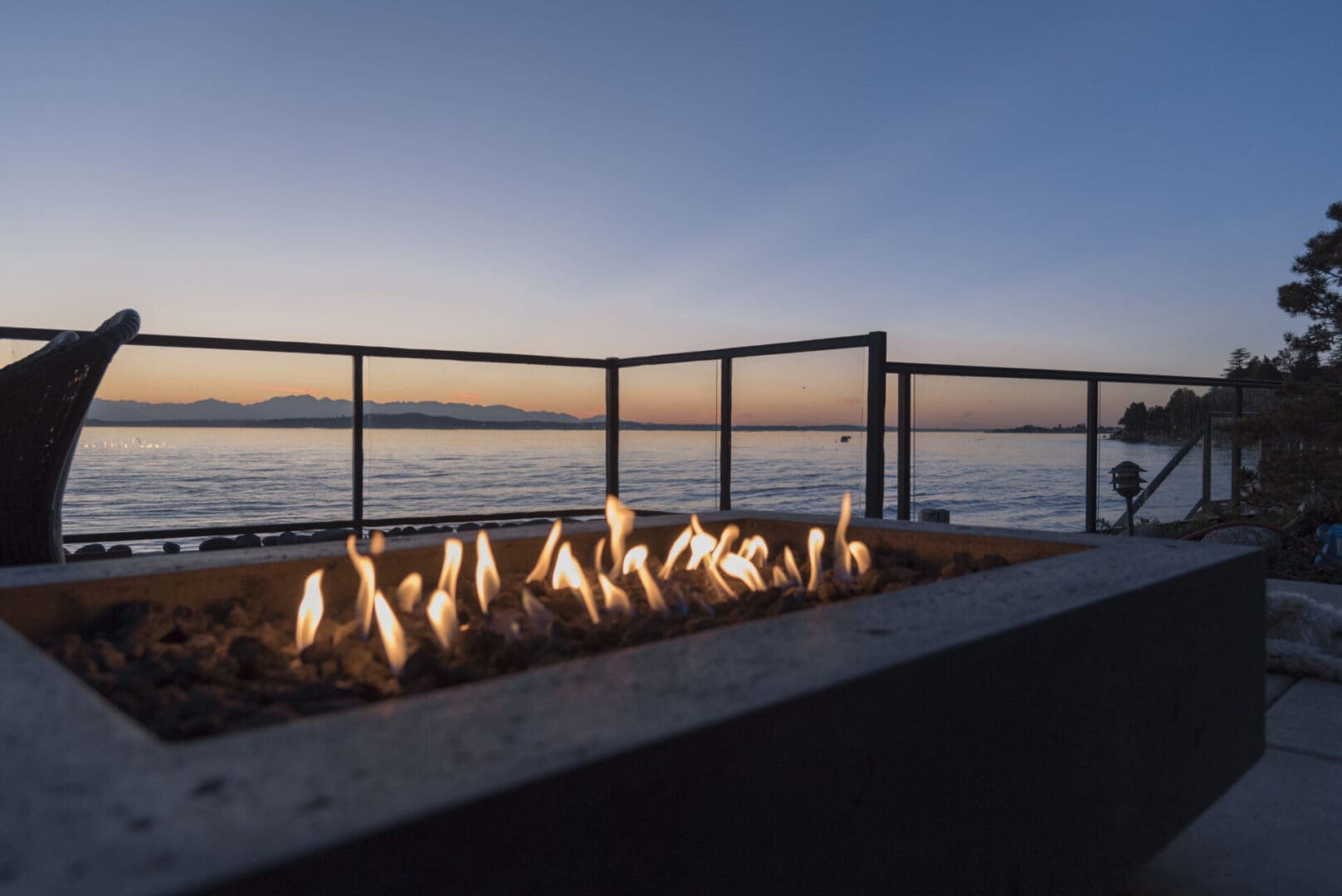 A fire pit with candles on top of it.