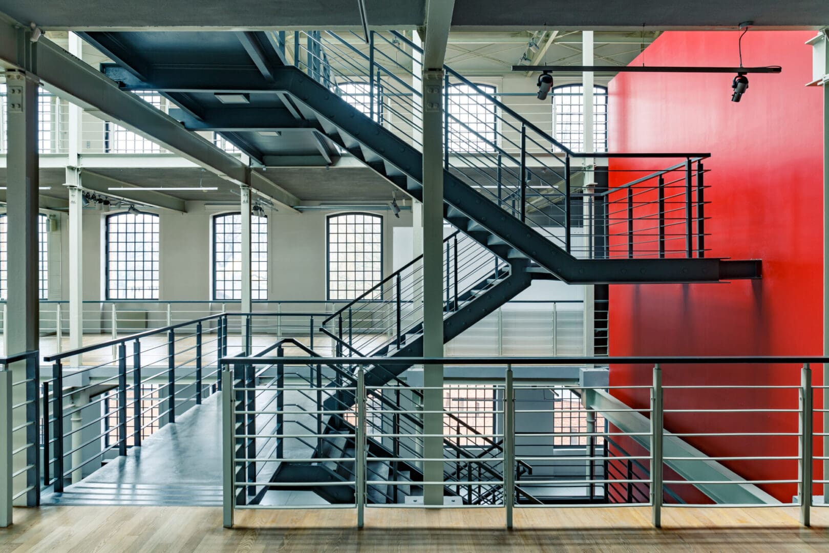 A large room with stairs leading to the top floor.