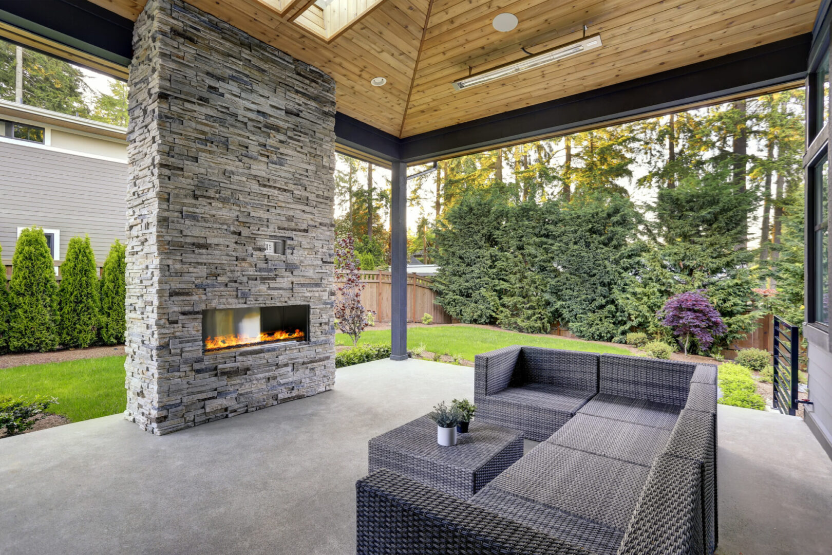 A patio with a couch and fireplace in it