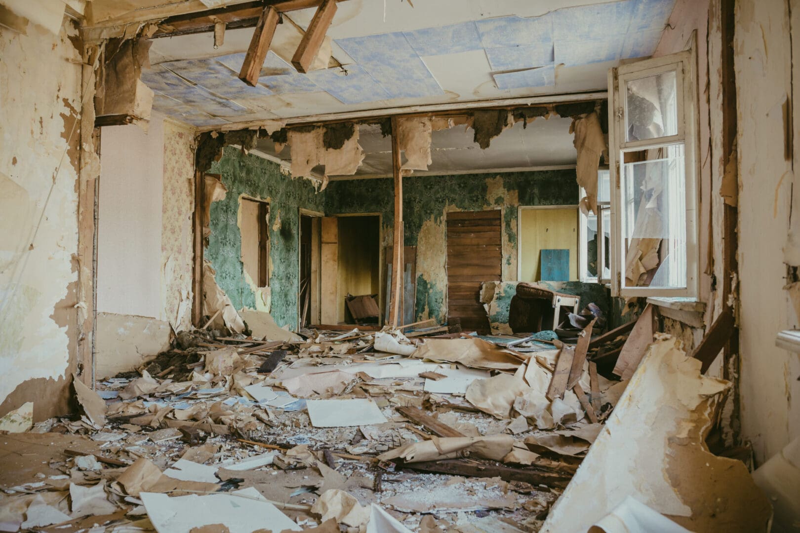 A room that has been demolished and torn up.