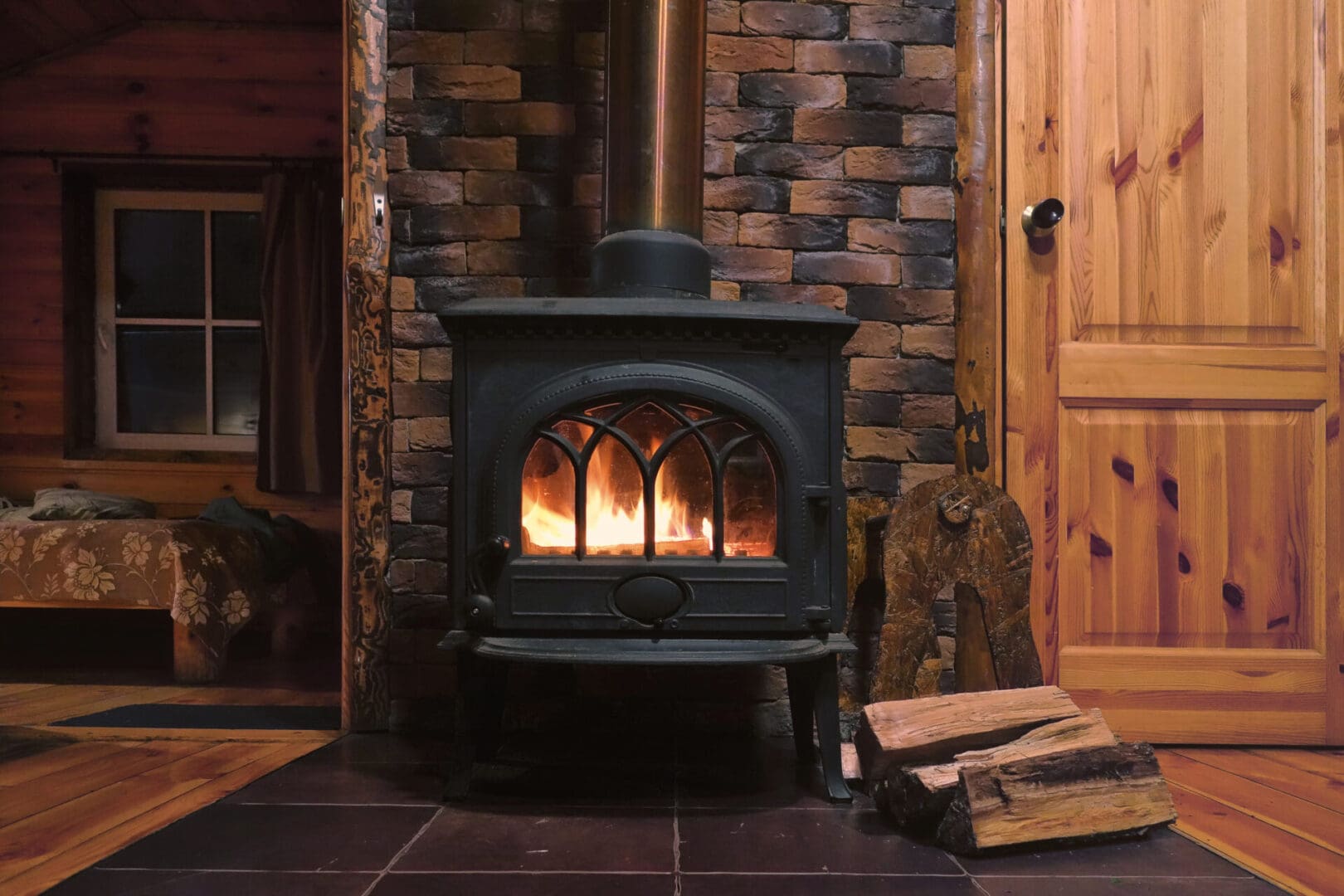 A fireplace with wood burning in it