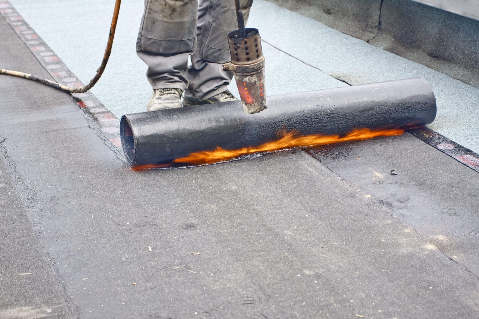 A person is holding onto the fire hose