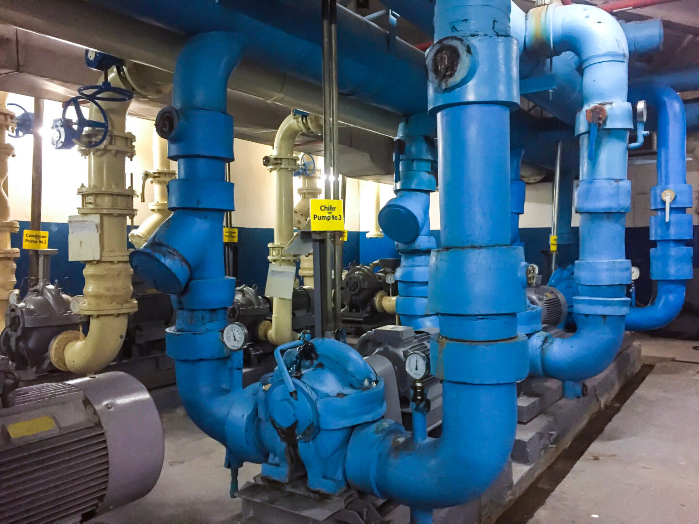 A large blue pipe system in a building.