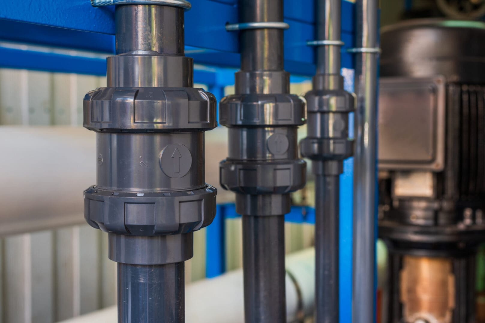 A close up of pipes with water valves