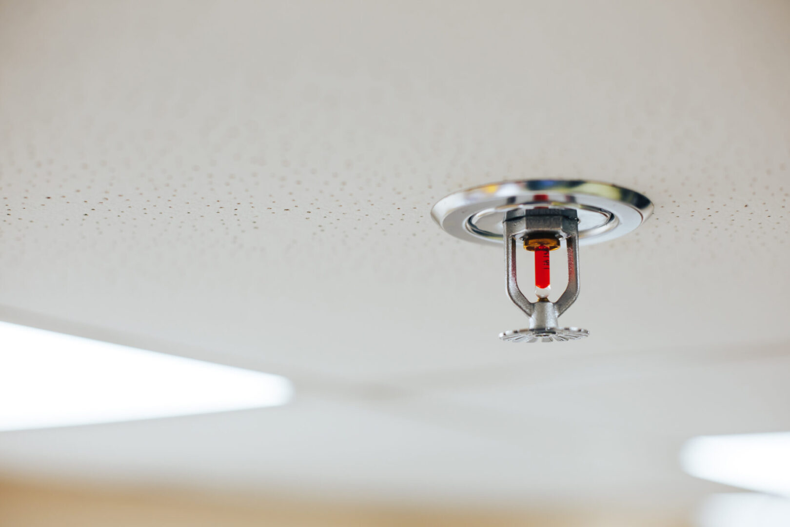 A fire sprinkler is shown in the ceiling.