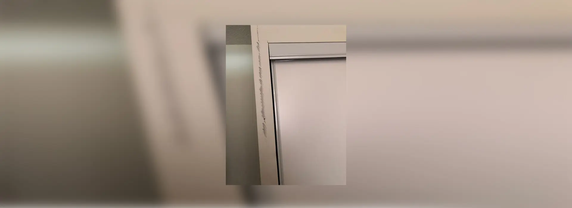 A picture of the outside of a door.