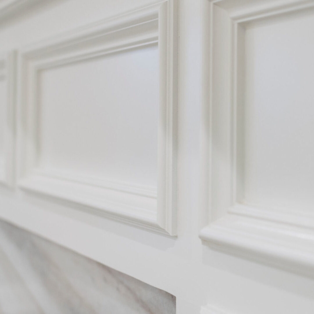 A close up of the white trim on a wall.