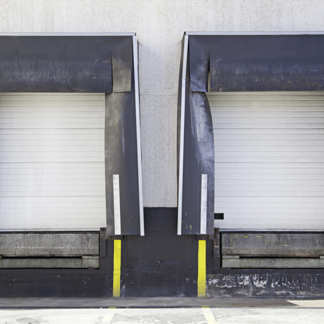 Two large doors that are open on a building.